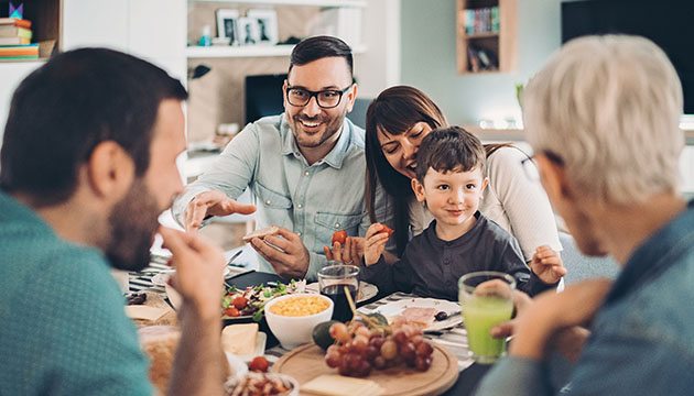 Family eats meal at table