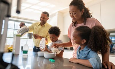 Two children and two adults at breakfast counter