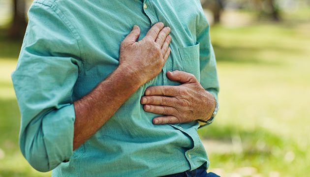 Person presses hands against chest