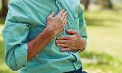 Person presses hands against chest