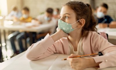 School girl stares into space