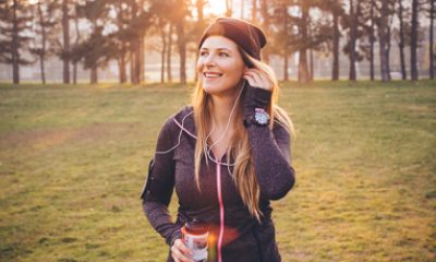 young woman stopping to rest from exercising outside in winter