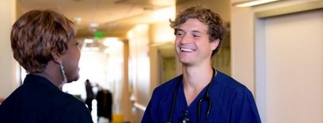 A nurse in the PeaceHealth residency program speaks with a nurse leader