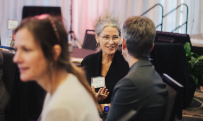 Two attendees of Women of Peace event talking