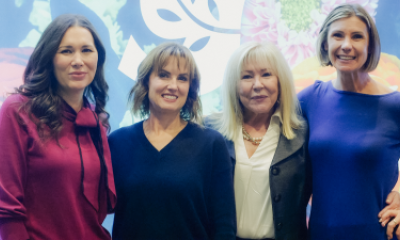Four women posing for a photo at Women of Peace event